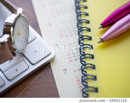 Business image · calendar · keyboard · notebook · woman 64081126