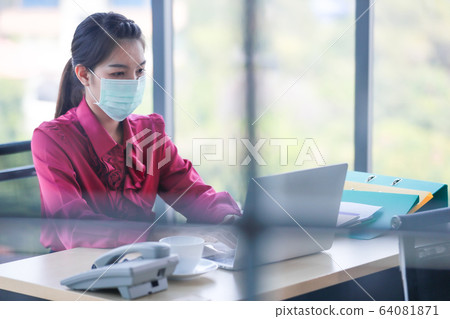 Woman wearing hygienic surgical mask. 64081871