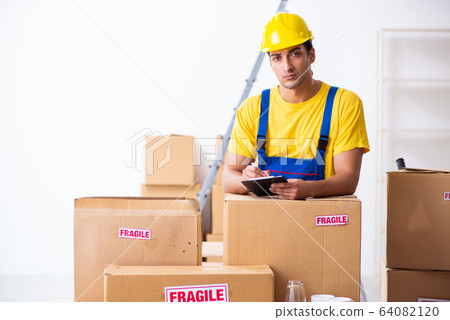 Young male professional mover doing home relocation Young male professional mover doing home relocation 64082120