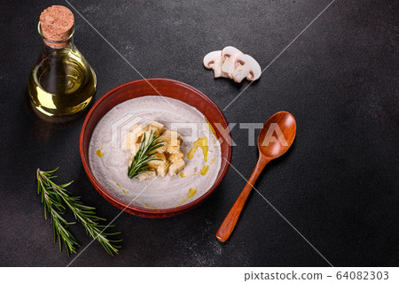 Delicious beautiful mushroom soup in a brown plate 64082303