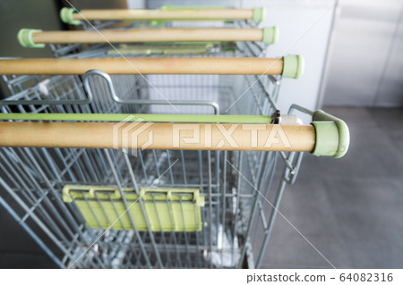 Empty shopping cart with dirty cart handle 64082316