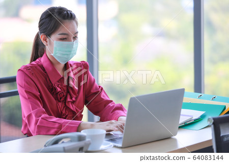 Woman wearing hygienic surgical mask. Woman wearing hygienic surgical mask. 64083144