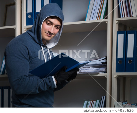 Young man in industrial espionage concept Young man in industrial espionage concept 64083626