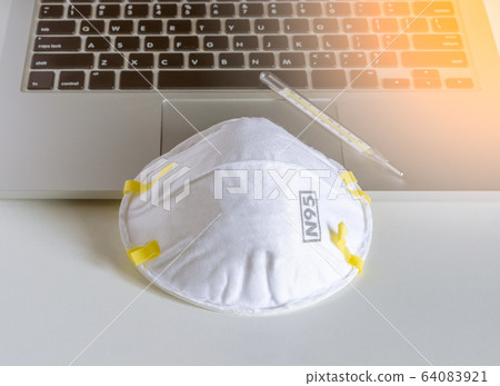N95 respirator mask and mercury-in-glass  64083921