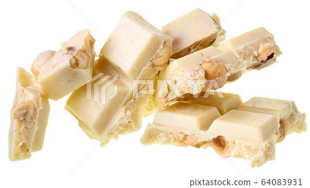 Broken white chocolate with whole hazelnut nuts Broken white chocolate with whole hazelnut nuts 64083931
