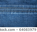 Close-up of jeans background with seams. Fabric backdrop with stitches 64083979