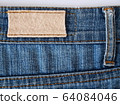 Close-up of old worn-out jeans label. 64084046