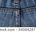 Close-up of jeans background with seams. Back seam of jeans Fabric backdrop with stitches 64084287