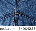 Close-up of jeans background with seams. Back seam of jeans Fabric backdrop with stitches 64084288