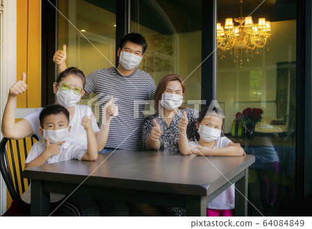 asian family quarantine at home while corona virus 64084849