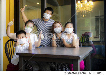 asian family quarantine at home while corona virus 64084853