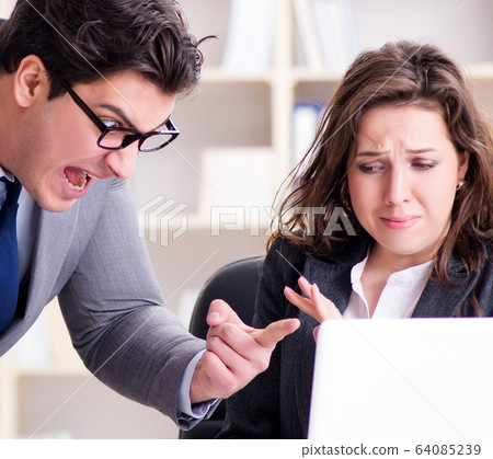Angry boss unhappy with female employee performance Angry boss unhappy with female employee performance 64085239