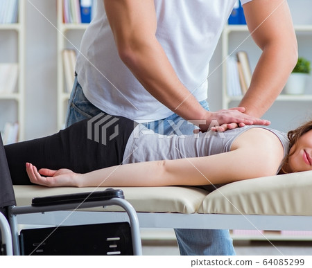 Patient undergoing rehabilitation recovery programme with doctor Patient undergoing rehabilitation recovery programme with doctor 64085299