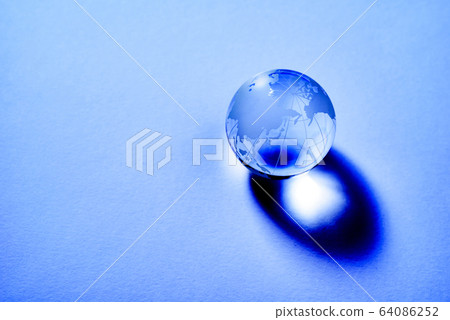 World globe on white paper with dark shadow World globe on white paper with dark shadow 64086252