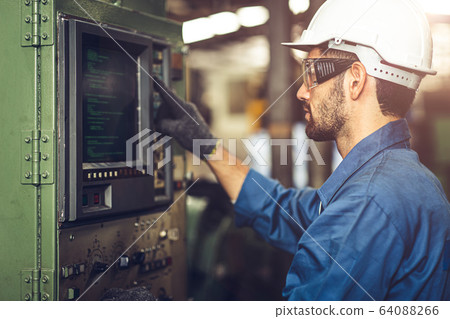 worker operate CNC machine with G-Code monitor, worker operate CNC machine with G-Code monitor, 64088266