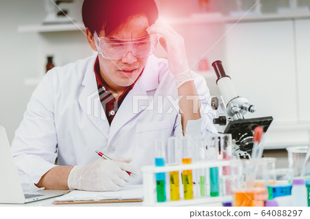 Scientist hardworking headache illness during longtime working in medical lab test 64088297