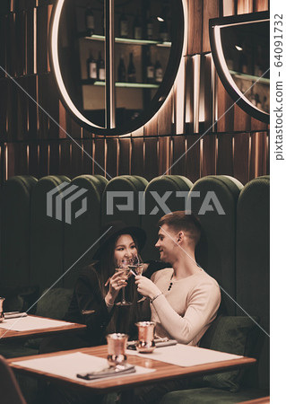 couple in love is sitting in a cafe couple in love is sitting in a cafe 64091732