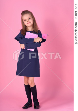 Back to school concept Half turned photo portrait of lovely confident beautiful clever girl with copybook notebook wearing school uniform dress pink bright backpack isolated Back to school concept Half turned photo portrait of lovely confident beautiful clever girl with copybook notebook wearing school uniform dress pink bright backpack isolated 64091834