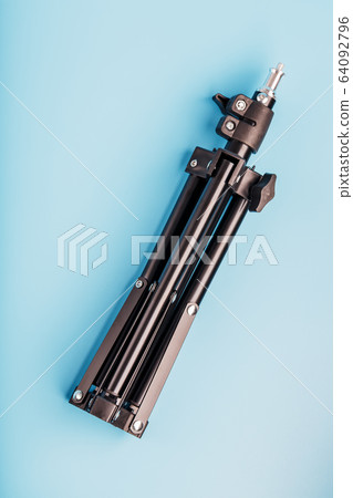Folded Tripod on a blue background for a Folded Tripod on a blue background for a 64092796