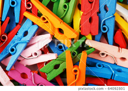 Colorful wooden clothespins close-up as a texture Colorful wooden clothespins close-up as a texture 64092801