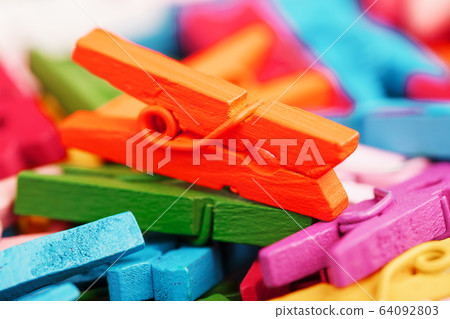 Small Clothespins of different colors close-up as Small Clothespins of different colors close-up as 64092803