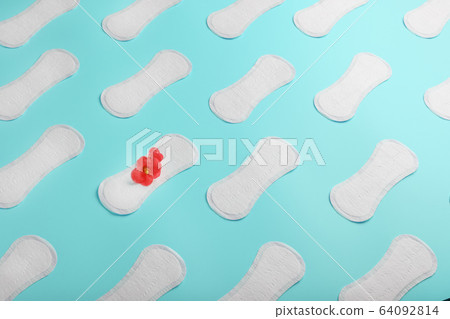 Many Sanitary pads on a blue background in the 64092814