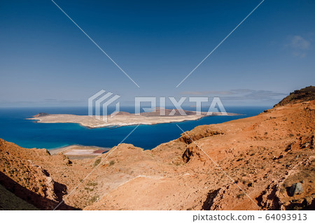 Viewpoint with La Graciosa, Lanzarote, Spain. Panorama of scenic view of La Graciosa Island 64093913
