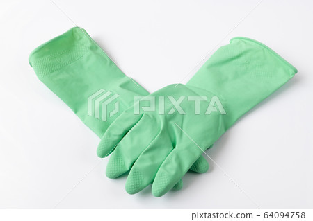 Green latex dishwashing gloves on a white background Green latex dishwashing gloves on a white background 64094758