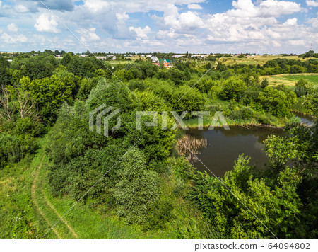 Picturesque summer countryside landscape in Russia from a height Picturesque summer countryside landscape in Russia from a height 64094802