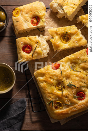 antipasti, focaccia and wine on a wooden table. Mediterranean lunch antipasti, focaccia and wine on a wooden table. Mediterranean lunch 64095062