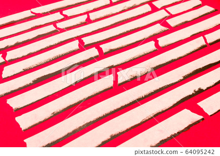 close up of an adhesive tape on red background 64095242