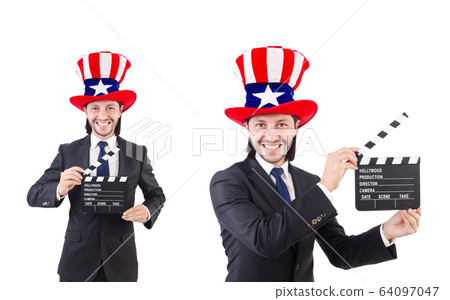 Man with USA hat and movie board isolated on white Man with USA hat and movie board isolated on white 64097047