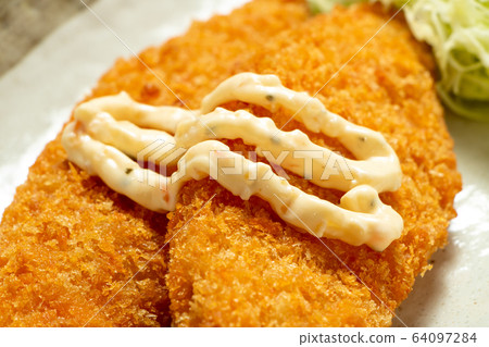 Tartar sauce fried in white fish fry. Tartar sauce fried in white fish fry. 64097284