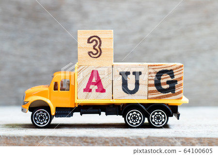 Truck hold letter block in word 3aug on wood background Truck hold letter block in word 3aug on wood background 64100605