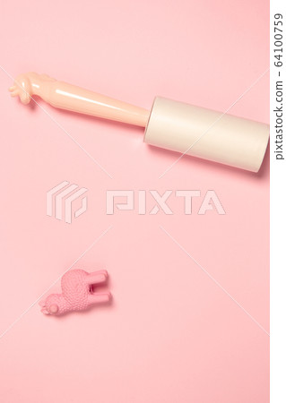 Wear roller and toy. Monochrome stylish composition in pink color. Top view, flat lay. Wear roller and toy. Monochrome stylish composition in pink color. Top view, flat lay. 64100759