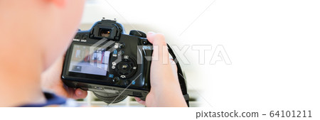 a 6 year old boy photographs his toys 64101211