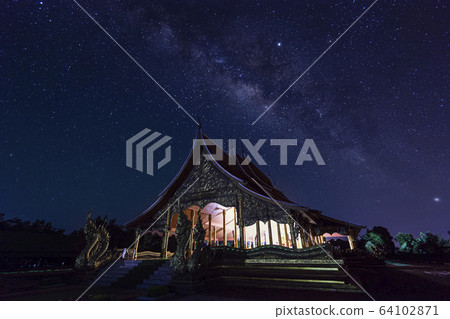 Night View of Wat Sirindhorn Wararam Phu Prao, Glow in the Dark Temple under the Milky Way, Ubon Ratchathani, Thailand 64102871
