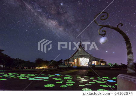 Night View of Wat Sirindhorn Wararam Phu Prao, Glow in the Dark Temple under the Milky Way, Ubon Ratchathani, Thailand Night View of Wat Sirindhorn Wararam Phu Prao, Glow in the Dark Temple under the Milky Way, Ubon Ratchathani, Thailand 64102874