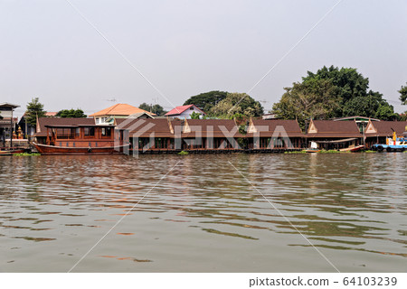 Traditional Thai house by the water Traditional Thai house by the water 64103239