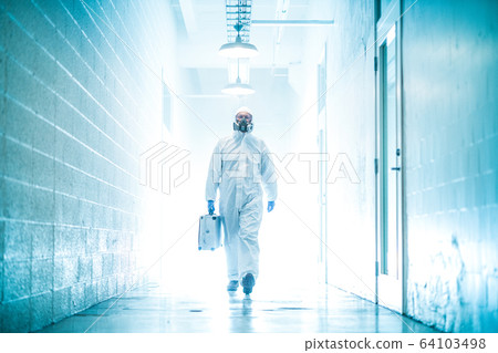 corona virus concept. male doctor waliking in coridor with biohazard case 64103498
