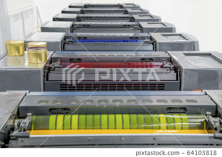 The top of a multicolor offset sheetfed printing press. The top of a multicolor offset sheetfed printing press. 64103818