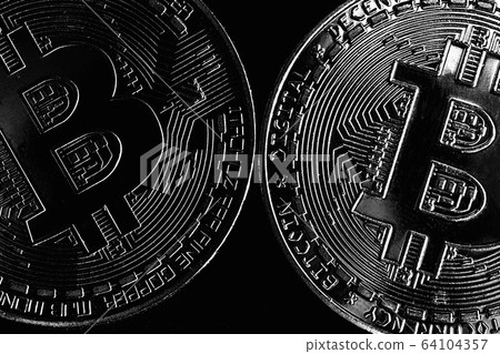 Bitcoin on black background. Photo in the dark key.  64104357