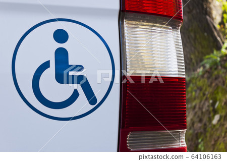 Accessible vehicle sign on white van 64106163