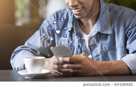 Smiling african teenager using cellphone with functional buttons 64106480