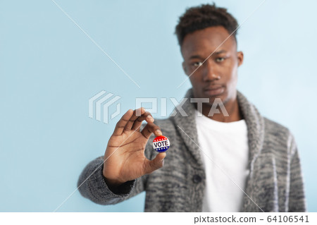 African Citizen of America holding Stickers with vote text African Citizen of America holding Stickers with vote text 64106541