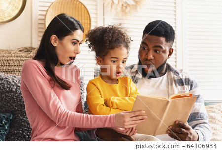 International family at home reading amazing fairytale International family at home reading amazing fairytale 64106933