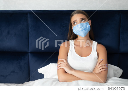 Depressed Girl Sitting In Bed Bored From Quarantine Lifestyle Depressed Girl Sitting In Bed Bored From Quarantine Lifestyle 64106973