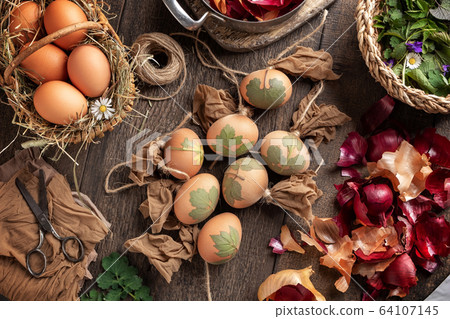 Preparation of Easter eggs for dying with onion Preparation of Easter eggs for dying with onion 64107145