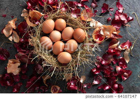 Raw eggs, ready to be dyed with onion peels 64107147