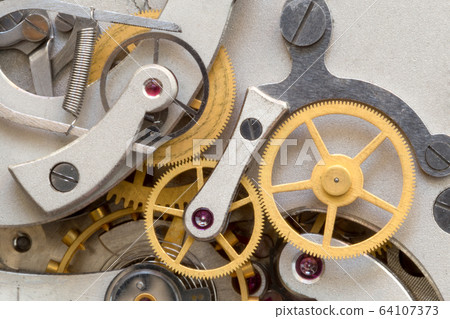 Old stopwatch mechanism closeup Old stopwatch mechanism closeup 64107373